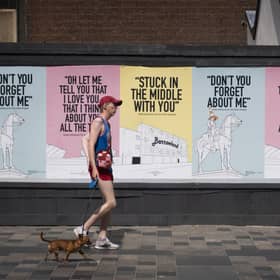 Posters with the message "keep looking out for each other Glasgow" and featuring song lyrics by Scottish artists such as Simple Minds, Dougie MacLean and Stealers Wheel have appeared around Glasgow city centre.