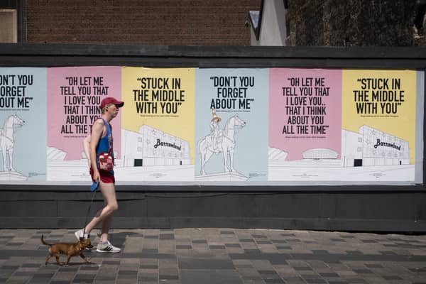 Posters with the message "keep looking out for each other Glasgow" and featuring song lyrics by Scottish artists such as Simple Minds, Dougie MacLean and Stealers Wheel have appeared around Glasgow city centre.