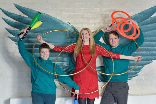 Gaelic singer Joy Dunlop launches this year's World Gaelic Week programme with the help of acrobatic educator Kit Rodman-Orr and Scott Craig, director of Community Circus Paisley. Picture: Julie Howden.