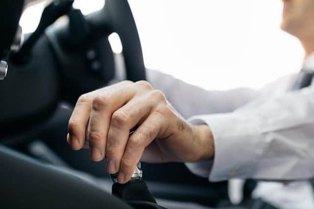 Stock image of man driving a car.