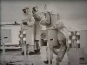 Government scientists with caged animals on a pontoon near Tolsta, Isle of Lewis, in 1952 as Operation Cauldron gets underway. PIC: YouTube.