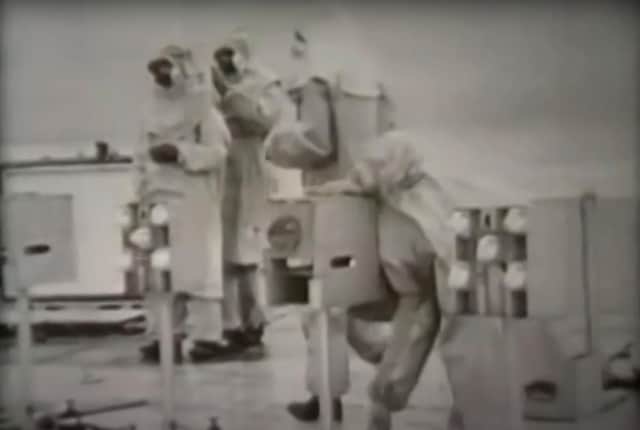 Government scientists with caged animals on a pontoon near Tolsta, Isle of Lewis, in 1952 as Operation Cauldron gets underway. PIC: YouTube.