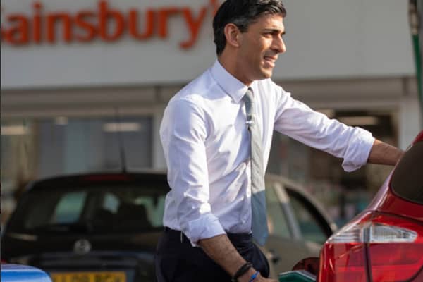 Rishi Sunak was pictured filling up at the forecourt ahead of the Spring budget statement, but the car later turned out not to be his. The Chancellor's attempt to stem rising fuel costs proves that he does not live in the real world. PIC: HM Treasury.