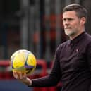Motherwell manager Graham Alexander watches on as his team lose out to Dundee.