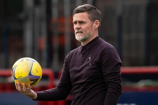 Motherwell manager Graham Alexander watches on as his team lose out to Dundee.