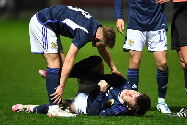 Scotland's Ben Doak goes down injured during the Under-21 friendly defeat to Iceland at Fir Park. (Photo by Ross MacDonald / SNS Group)
