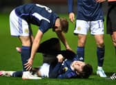Scotland's Ben Doak goes down injured during the Under-21 friendly defeat to Iceland at Fir Park. (Photo by Ross MacDonald / SNS Group)