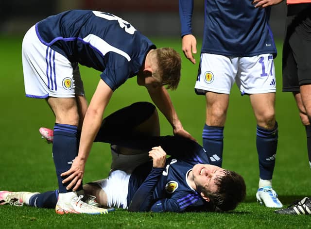 Scotland's Ben Doak goes down injured during the Under-21 friendly defeat to Iceland at Fir Park. (Photo by Ross MacDonald / SNS Group)
