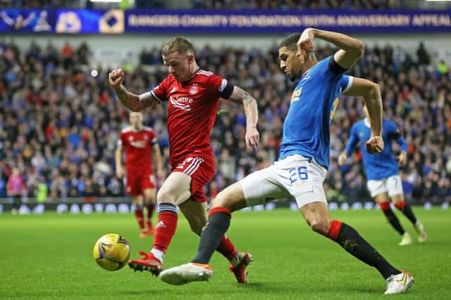 Aberdeen's Jonny hayes (left) tussles with Rangers' Leon Balogun during a Cinch Premiership match between Rangers and Aberdeen at Ibrox stadium, on October 26, 2021, in Glasgow, Scotland. (Photo by Alan Harvey / SNS Group)