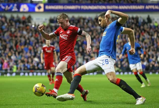 Aberdeen's Jonny hayes (left) tussles with Rangers' Leon Balogun during a Cinch Premiership match between Rangers and Aberdeen at Ibrox stadium, on October 26, 2021, in Glasgow, Scotland. (Photo by Alan Harvey / SNS Group)