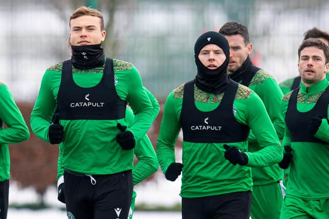 Hibs duo Ryan Porteous (left) and Kevin Nisbet train on Monday morning, but team-mate Stevie Mallan is in Turkey finalising a loan move to Yeni Malatyaspor (Photo by Ross MacDonald / SNS Group)