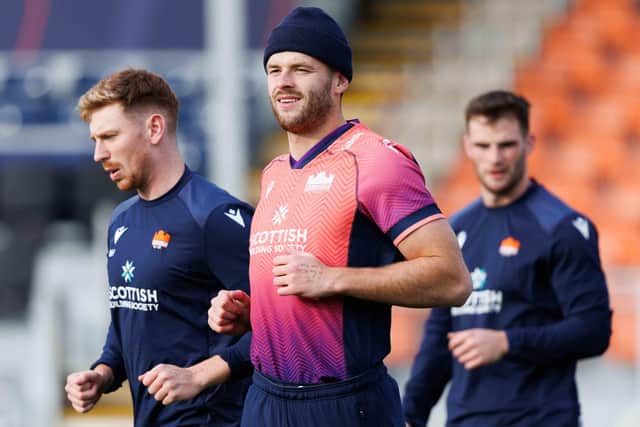 Blair Kinghorn, centre, with Ben Healy, left, during an Edinburgh Rugby training session at the Hive Stadium where they will face the Lions on Saturday. (Photo by Ross Parker / SNS Group)