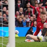 Manchester United's Scott McTominay sits injured during the Premier League match at Old Trafford, Manchester.  (Picture: Martin Rickett/PA Images)