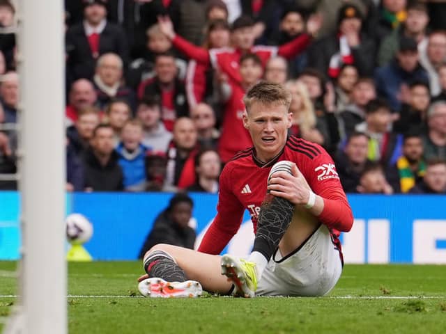 Manchester United's Scott McTominay sits injured during the Premier League match at Old Trafford, Manchester.  (Picture: Martin Rickett/PA Images)