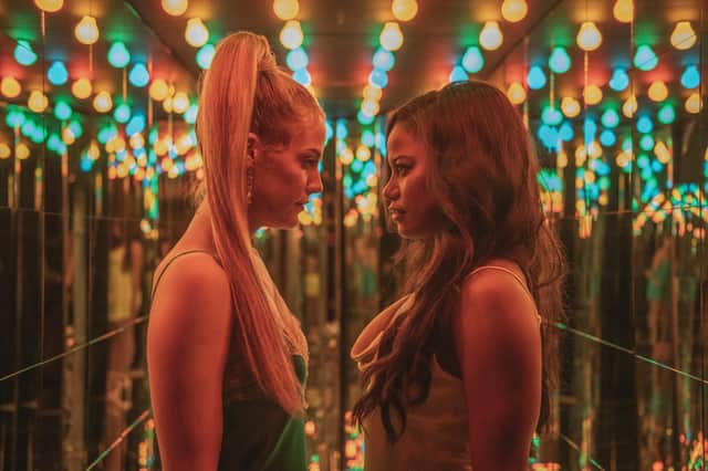 Taylour Paige and Riley Keough in Zola