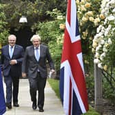 Prime Minister Boris Johnson, right, walks with Australian Prime Minister Scott Morrison after their meeting, in the garden of 10 Downing Street in London in June. Picture: Dominic Lipinski/Pool Photo via AP
