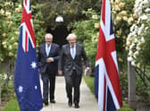 Prime Minister Boris Johnson, right, walks with Australian Prime Minister Scott Morrison after their meeting, in the garden of 10 Downing Street in London in June. Picture: Dominic Lipinski/Pool Photo via AP