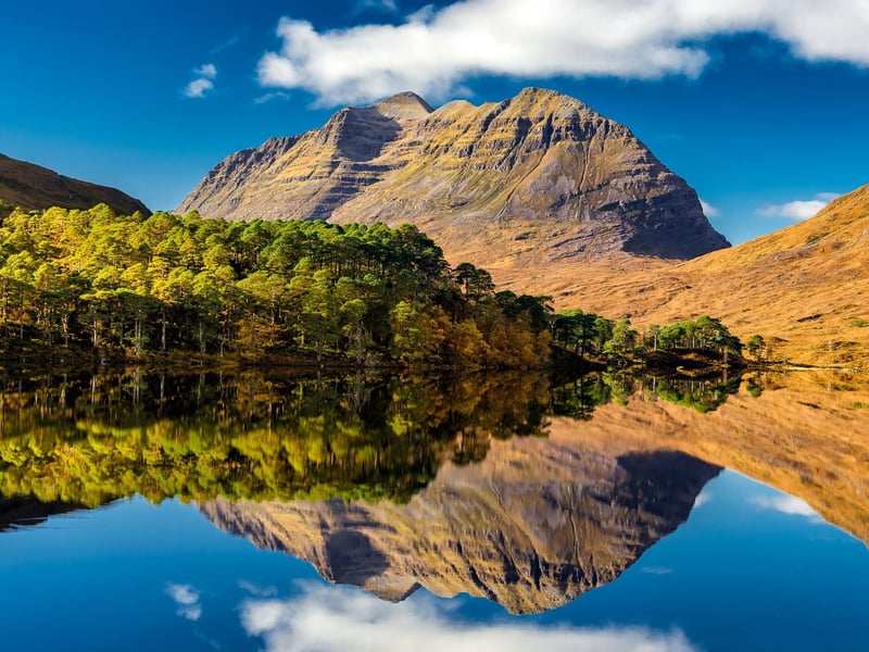 Towering in the middle of the Torridon Hills, in the northwest Highlands, Liathach actually comprises two Munros - Mullach an Rathain and Spidean a' Choire Leith. Both have steep ascents, while traversing the ridge linking the two requires a real head for heights, with sheer drops seemingly in all directions.