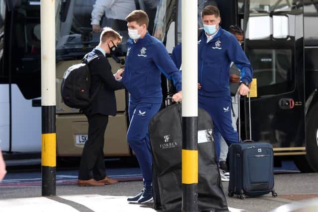 Rangers manager Steven Gerrard (centre) arrives at Glasgow Airport ahead of his team's flight to Prague on Wednesday afternoon. (Photo by Craig Williamson / SNS Group)