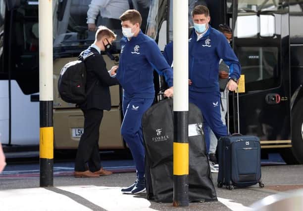 Rangers manager Steven Gerrard (centre) arrives at Glasgow Airport ahead of his team's flight to Prague on Wednesday afternoon. (Photo by Craig Williamson / SNS Group)