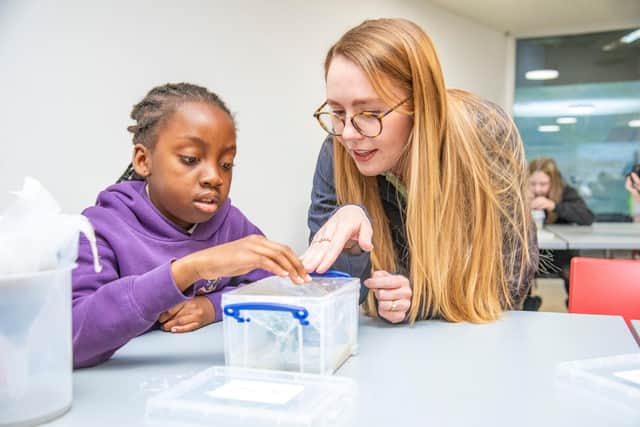 Emma Robson from Scottish Water with a pupil from St Pius primary school in Dundee