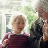 The late Robin Morton, teaching his granddaughter to play the spoons. A re-edited version of his 1970 book Folksongs Sung in Ulster has been published by Kinmor Music.