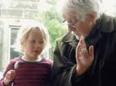 The late Robin Morton, teaching his granddaughter to play the spoons. A re-edited version of his 1970 book Folksongs Sung in Ulster has been published by Kinmor Music.