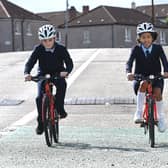 Lochlan Griffiths, ten, and Gabriella Oude, nine, from St Pholomena's Primary  School, demonstrating the new bikes today. Picture: John Devlin