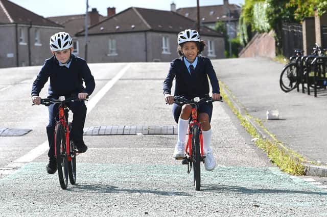 Lochlan Griffiths, ten, and Gabriella Oude, nine, from St Pholomena's Primary  School, demonstrating the new bikes today. Picture: John Devlin
