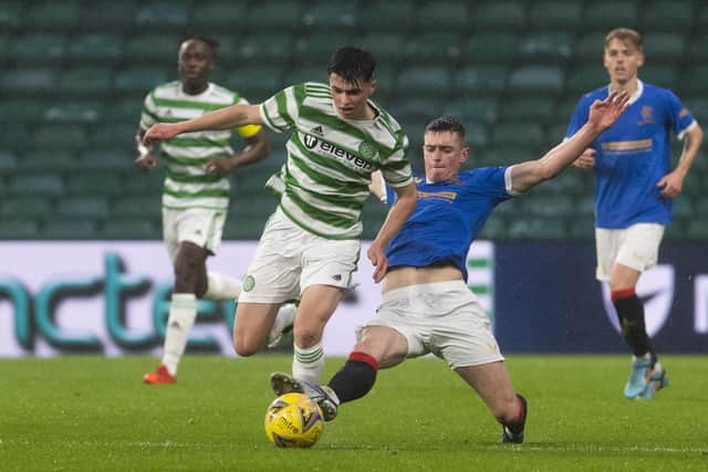 Mathew Anderson battles with Cole McKinnon during a Scottish Lowland League match between Celtic B and Rangers B.