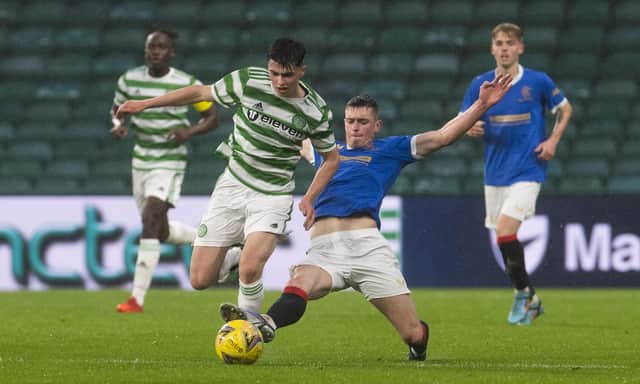 Mathew Anderson battles with Cole McKinnon during a Scottish Lowland League match between Celtic B and Rangers B.