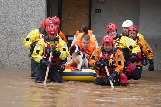 Rescue teams during storm Babet in Brechin last year (pic: Andrew Milligan/PA)
