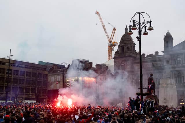 Rangers fans celebrating their title win in George Square in March. Picture: SNS