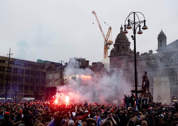 Rangers fans celebrating their title win in George Square in March. Picture: SNS