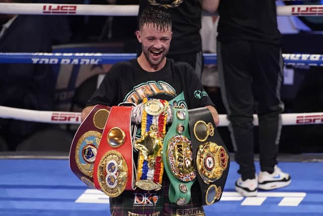 Josh Taylor celebrates with his belts after defeating Jose Ramirez. Picture: John Locher/AP