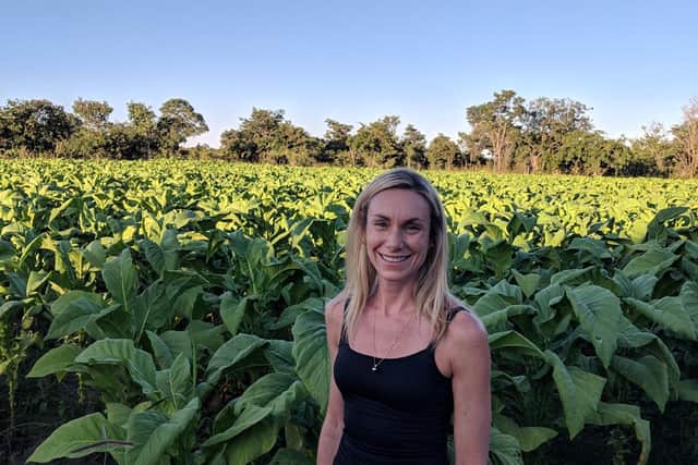 Ms Hurley in a tobacco field in Kabwe, Zambia, in 2019. Picture: Gail Hurley.