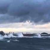A video has been posted showing high waves crashing over the sea wall and onto the train tracks in the Saltcoats area of Scotland (Photo: Network Rail Scotland).