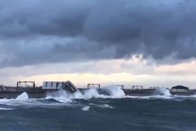 A video has been posted showing high waves crashing over the sea wall and onto the train tracks in the Saltcoats area of Scotland (Photo: Network Rail Scotland).