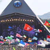 Festivalgoers watch US legend Diana Ross perform on the Pyramid Stage at the Glastonbury festival near the village of Pilton in Somerset, south-west England, on June 26, 2022. (Photo by ANDY BUCHANAN/AFP via Getty Images)