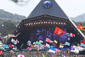 Festivalgoers watch US legend Diana Ross perform on the Pyramid Stage at the Glastonbury festival near the village of Pilton in Somerset, south-west England, on June 26, 2022. (Photo by ANDY BUCHANAN/AFP via Getty Images)