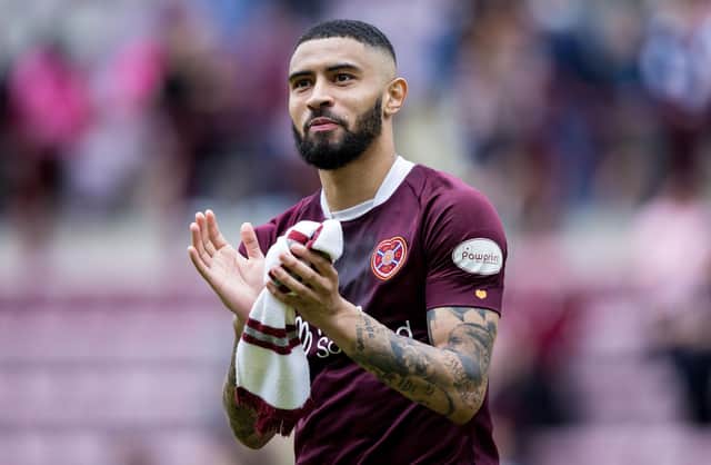 Josh Ginnelly applauds the Hearts fans after the 1-1 draw with Hibs at Tynecastle.