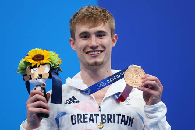 Jack Laugher poses with his bronze medal