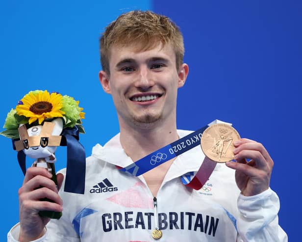 Jack Laugher poses with his bronze medal