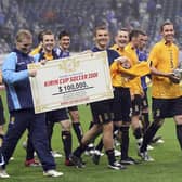 David Weir of Scotland holds a winning trophy with team after playing in the Kirin Cup Soccer 2006 between Scotland and Japan at the Saitama stadium on May 13, 2006 in Saitama, Japan. (Photo by Koichi Kamoshida/Getty Images)