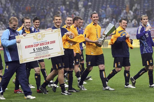 David Weir of Scotland holds a winning trophy with team after playing in the Kirin Cup Soccer 2006 between Scotland and Japan at the Saitama stadium on May 13, 2006 in Saitama, Japan. (Photo by Koichi Kamoshida/Getty Images)
