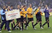 David Weir of Scotland holds a winning trophy with team after playing in the Kirin Cup Soccer 2006 between Scotland and Japan at the Saitama stadium on May 13, 2006 in Saitama, Japan. (Photo by Koichi Kamoshida/Getty Images)