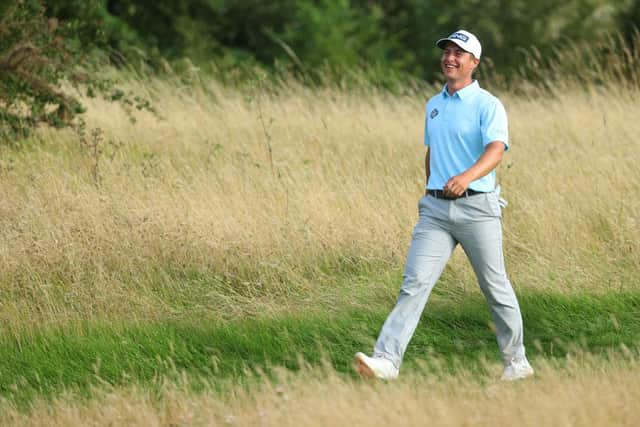 Calum Hill smiles as he walks on the 17th hole in the second round of the Cazoo Classic at the London Golf Club. Picture: Andrew Redington/Getty Images.