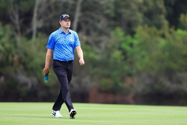 Russell Knox walks up the the 14th hole during the first round at TPC Sawgrass. Picture: Mike Ehrmann/Getty Images.