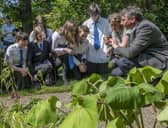 Dr Emma Bush and Raoul Curtis-Machin engaging with school pupils on the potential for using nature based solutions to benefit urban environments (Pic: RBGE)