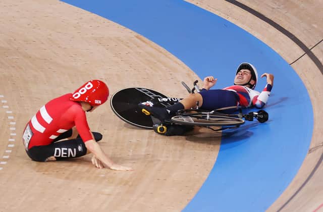 Frederik Madsen and Charlie Tanfield on the ground after colliding during the Men´s team pursuit